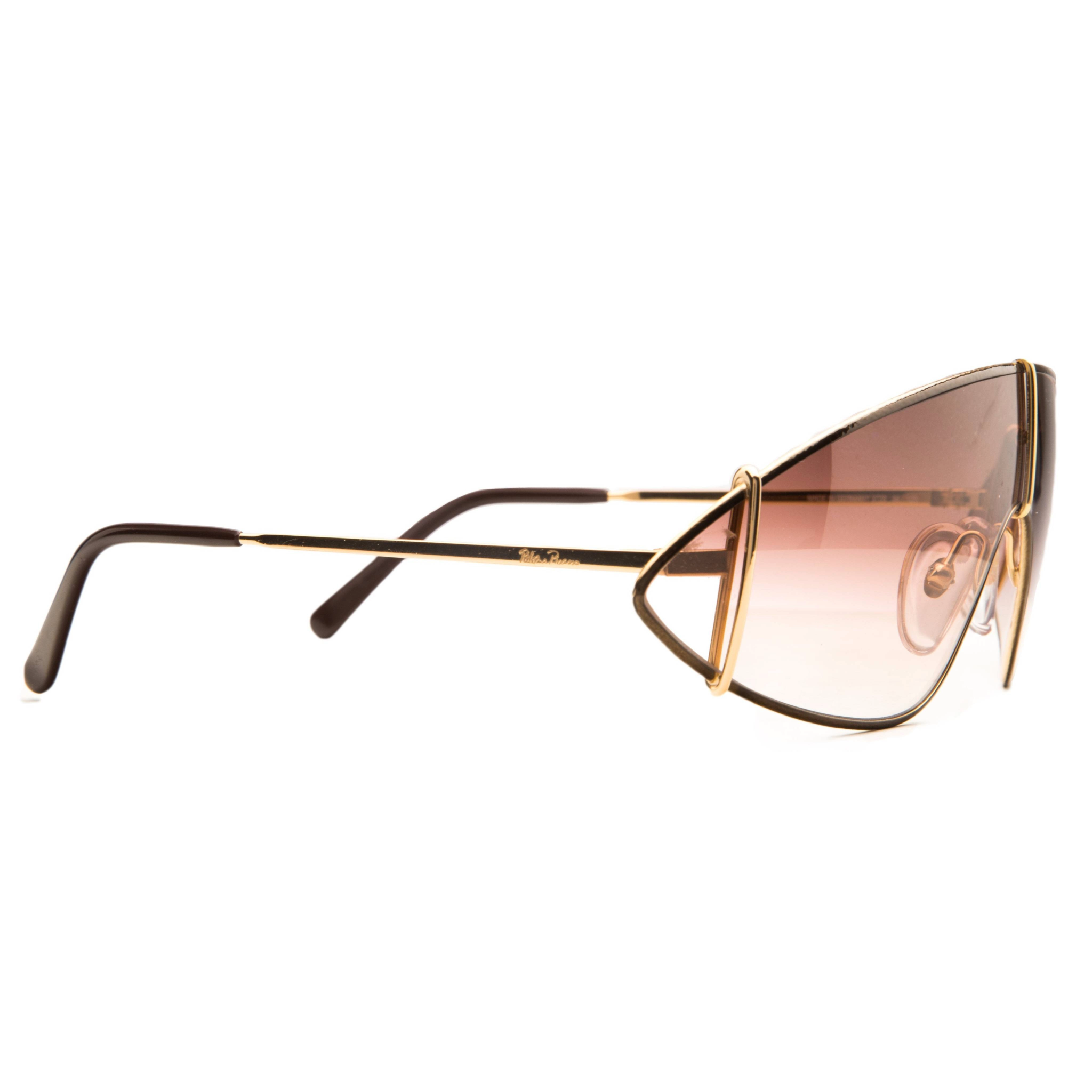 Paloma Picasso Visor 3728 sunglasses with black frame and gold accents