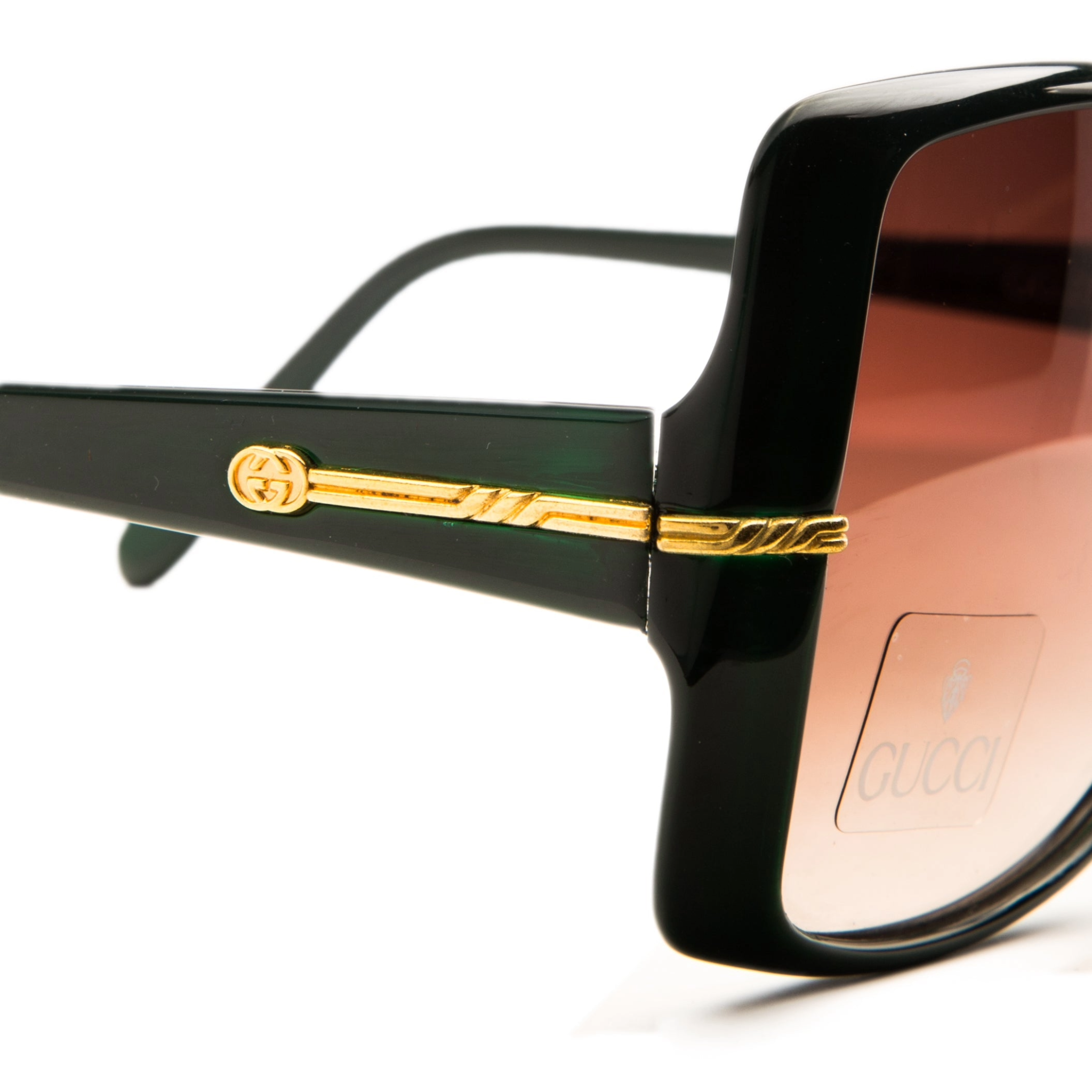Original Vintage Gucci Square 42215 oversized sunglasses crafted for women, with a glossy dark green frame and brown lenses providing 100% UV protection