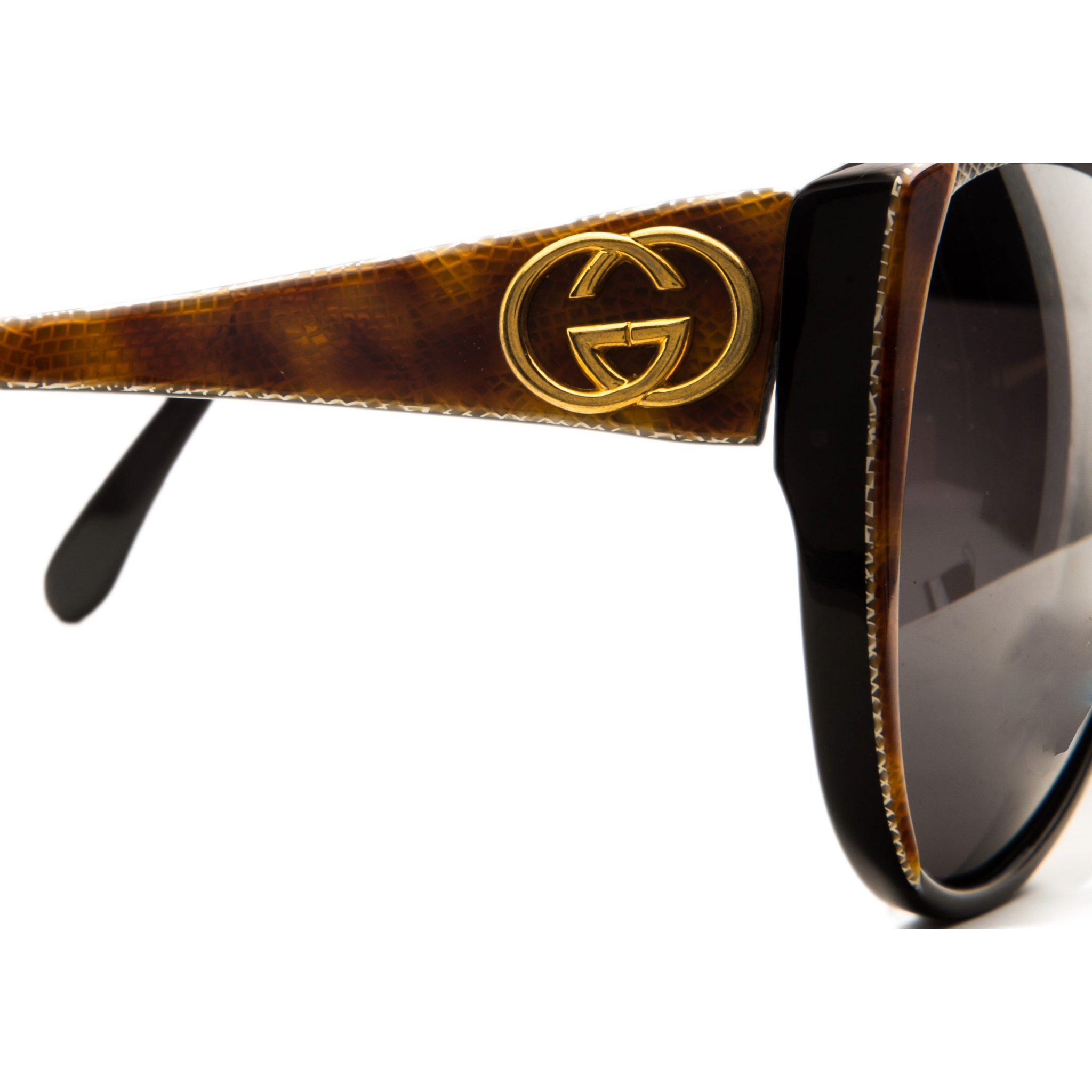 Vintage Gucci Cat Eye 2108546 sunglasses with red marble frame, black smoke lens, and 100% UV protection for women