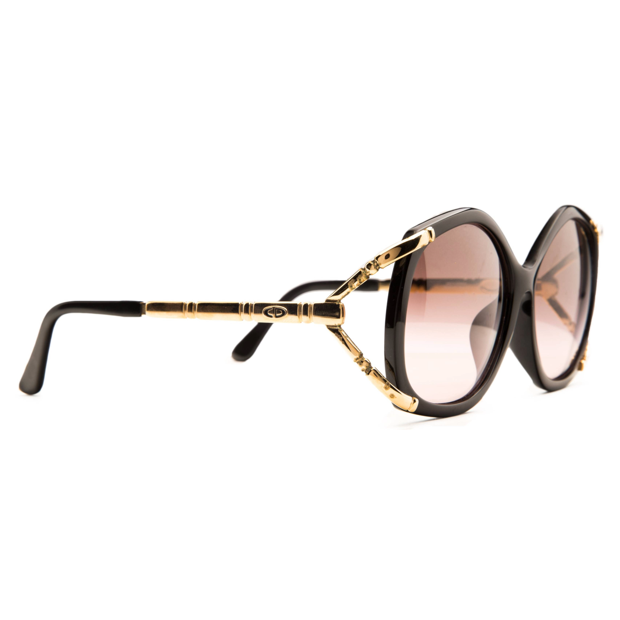 Authentic and never before worn or sold vintage Christian Dior sunglasses in black frame and black smoke lenses