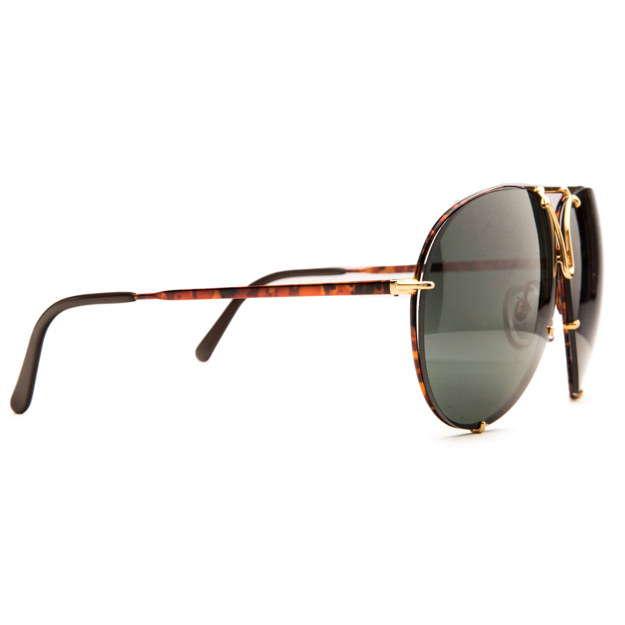 Authentic vintage Porsche Aviator 5623 sunglasses designed for both men and women, featuring a gold tort combination frame and black smoke lens with 100% UV protection, never before worn or sold