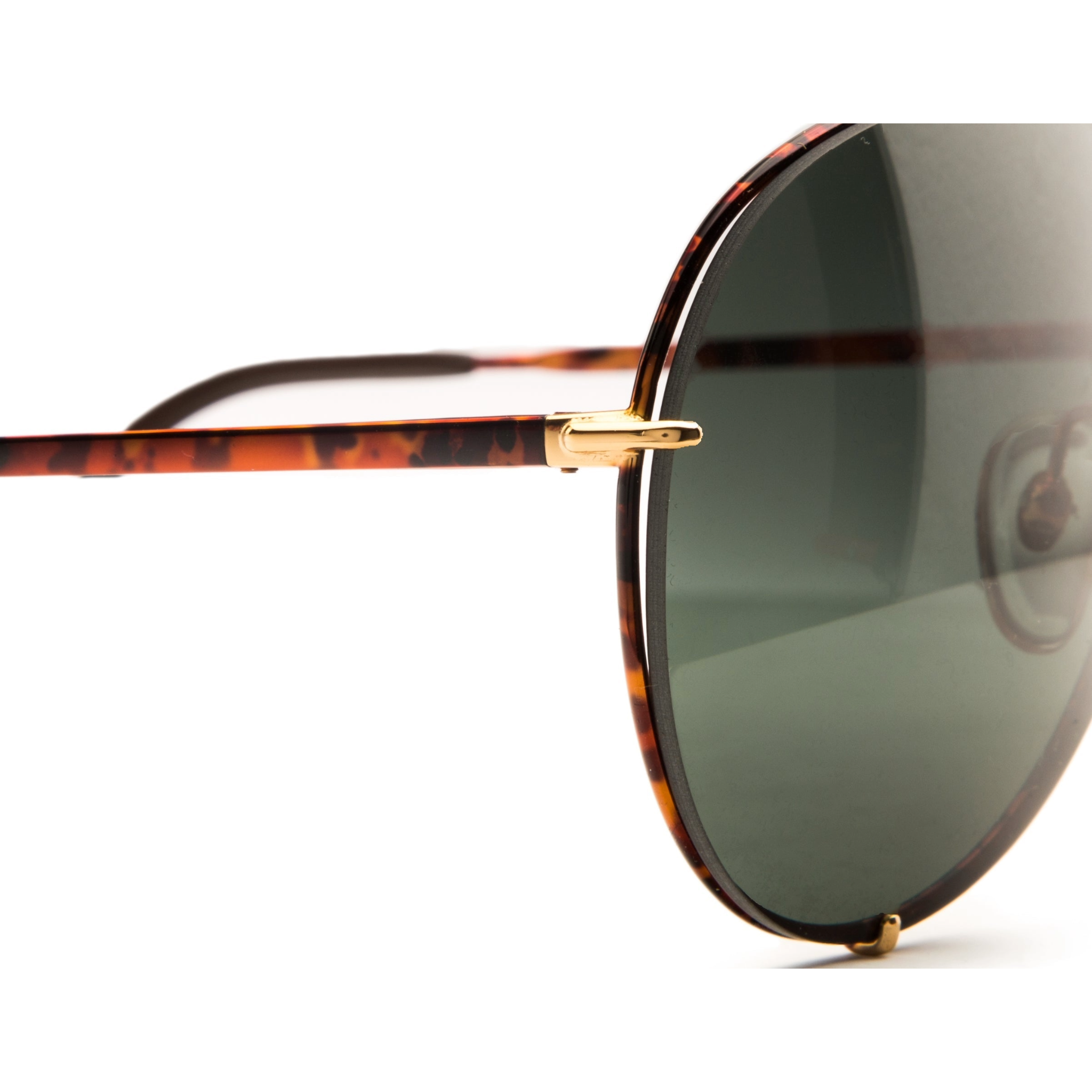 A pair of vintage Porsche Aviator 5623 sunglasses made for men and women, with a gold tort combination frame and black smoke lens providing 100% UV protection, in superb condition and never previously worn or sold