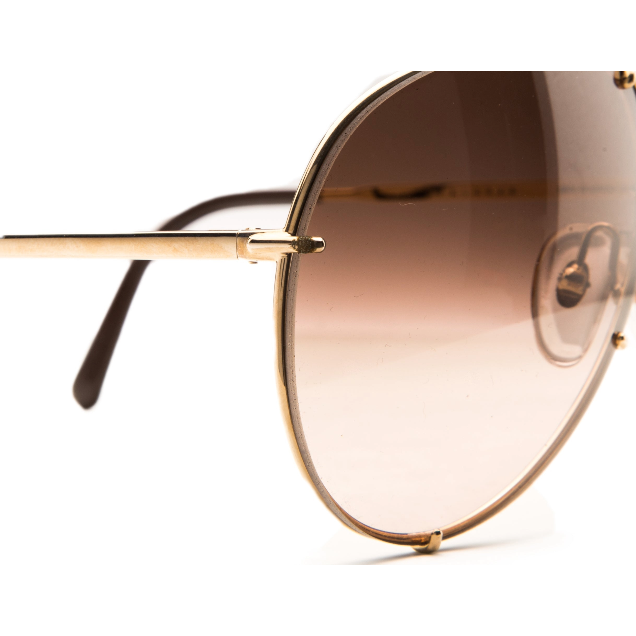 Never before worn or sold, these vintage Porsche Aviator 5623 46 sunglasses for men and women feature a gold frame, brown lenses, and 100% UV protection