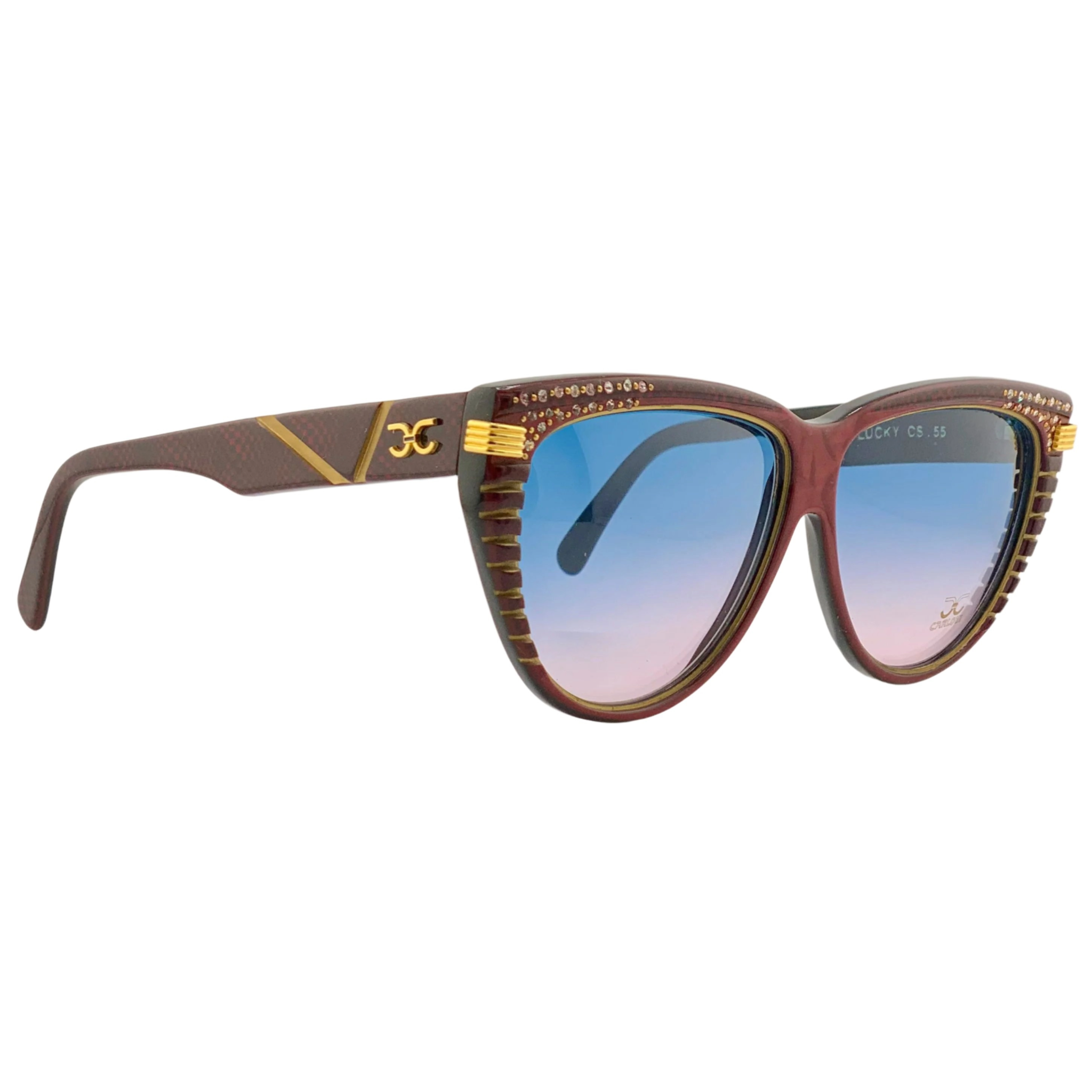 Close up of red and gold cat eye sunglasses with blue and pink gradient lenses, by Claudia Carlotti, hand made in France and never before worn or sold, in superb condition