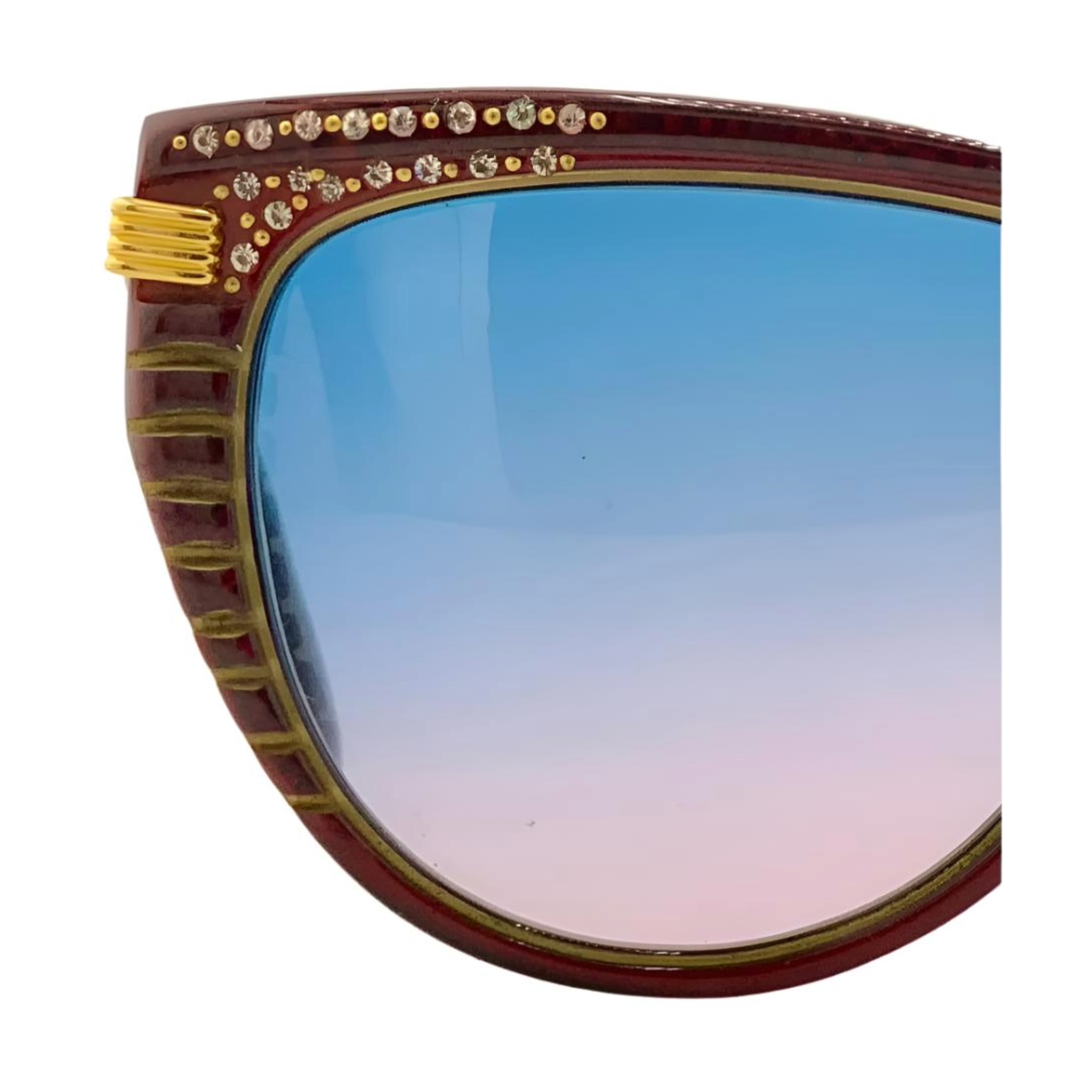 Detailed shot of the red and gold cat eye sunglasses by Claudia Carlotti, with blue and pink gradient lenses, hand made in France and in superb condition, never before worn or sold