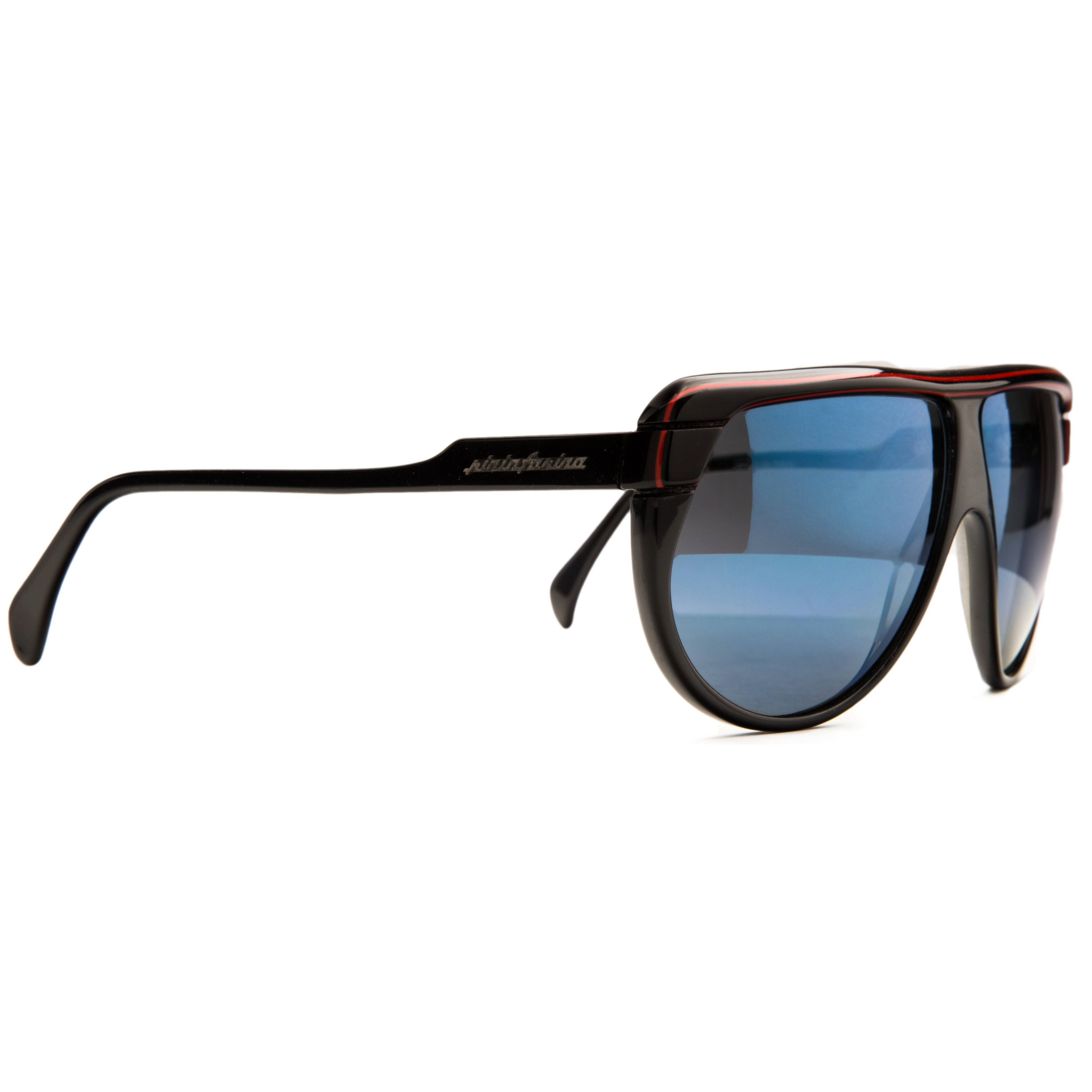 Front view of vintage Persol Pininfarina Flat Brow 811 sunglasses with black and red frame and blue Revo lenses