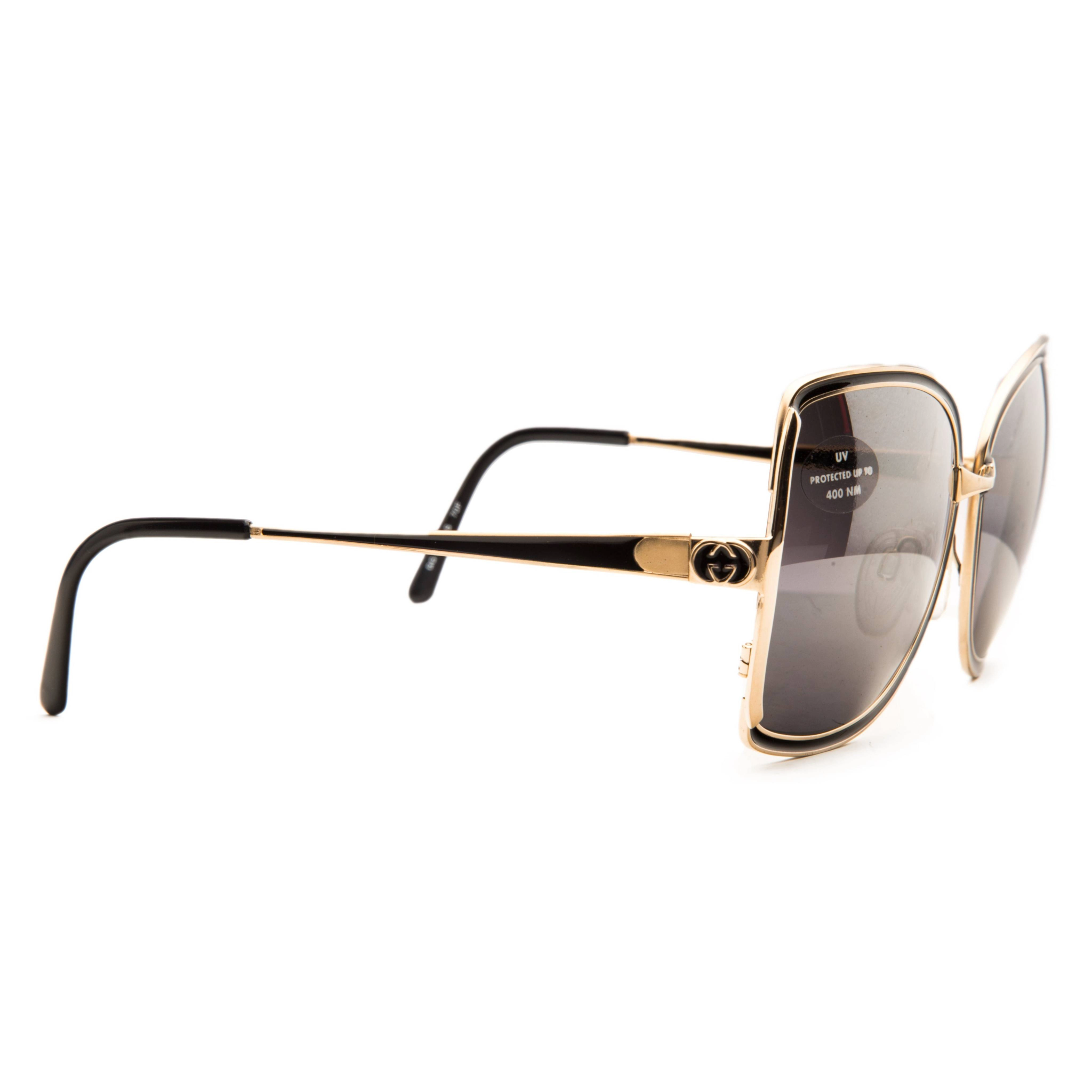 Black Gucci Square 22025 sunglasses with gold accents on the arms