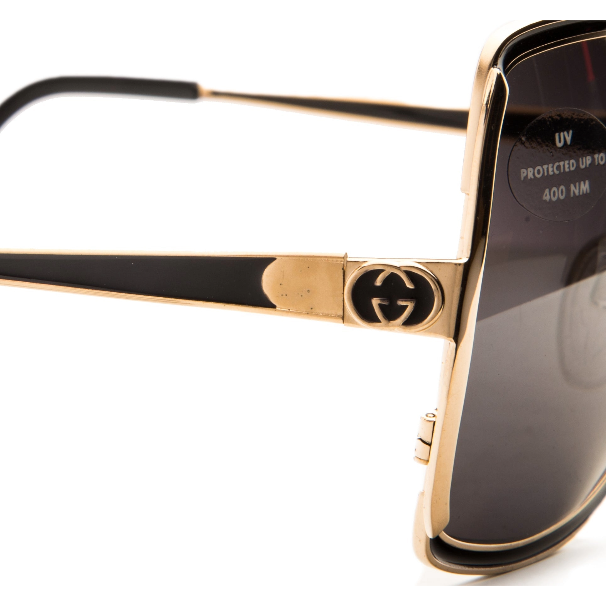 Black Gucci Square 22025 sunglasses with gold embellishments and tinted lenses