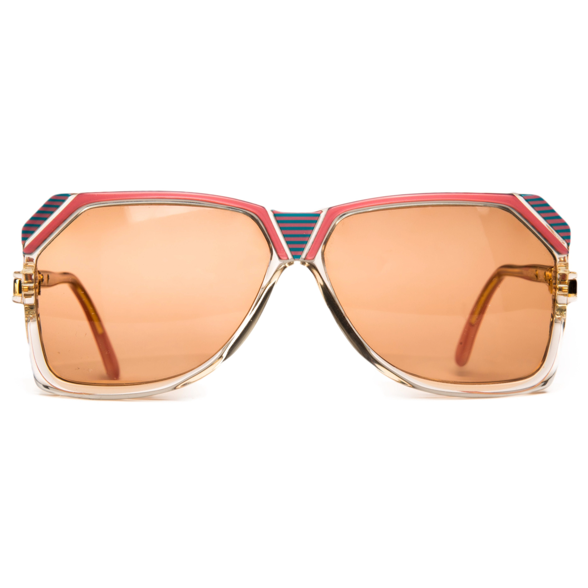 Cazal Square 186 Sunglasses: Black square frames with gold accents