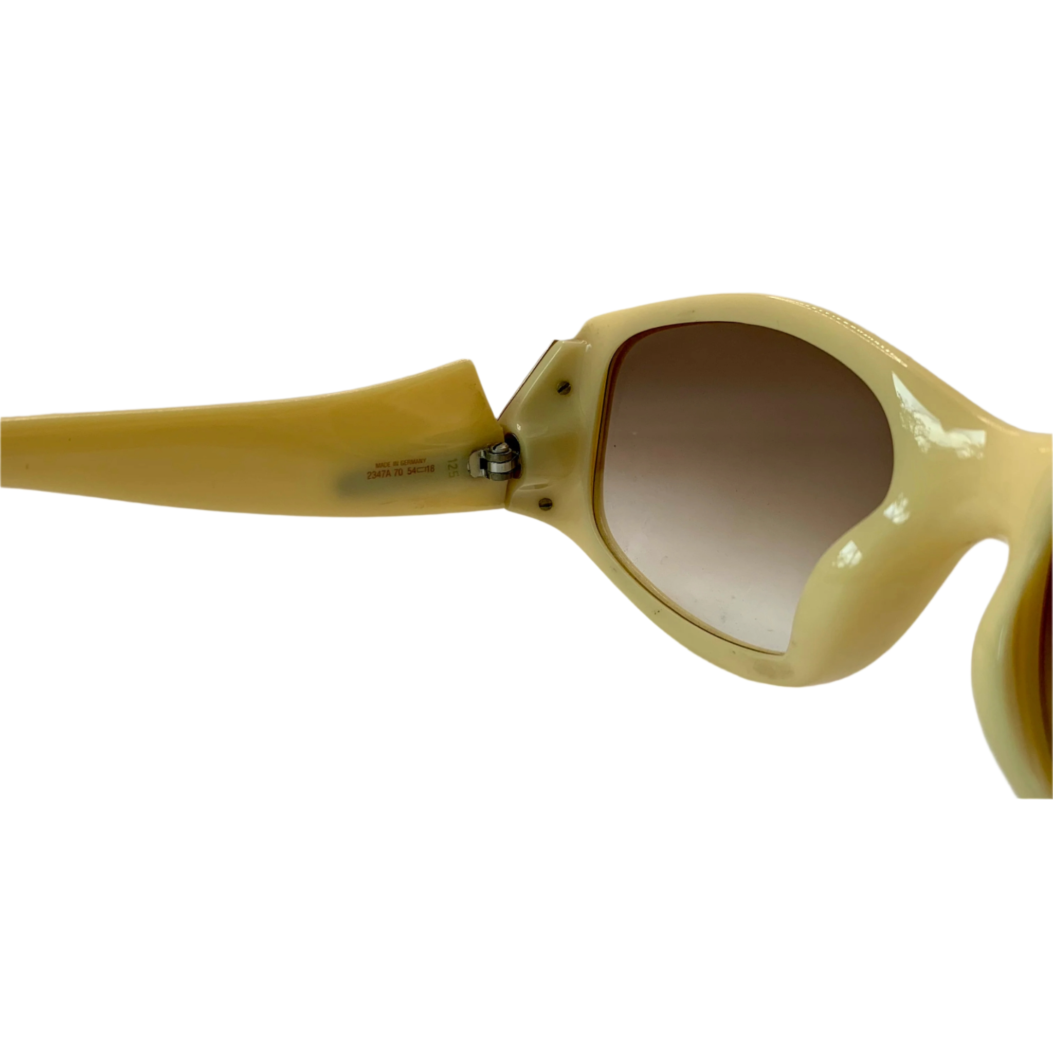 Black oval-shaped Christian Dior sunglasses with gold accents and tinted lenses